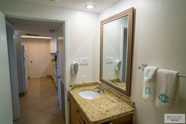 bathroom with vanity and tile patterned floors