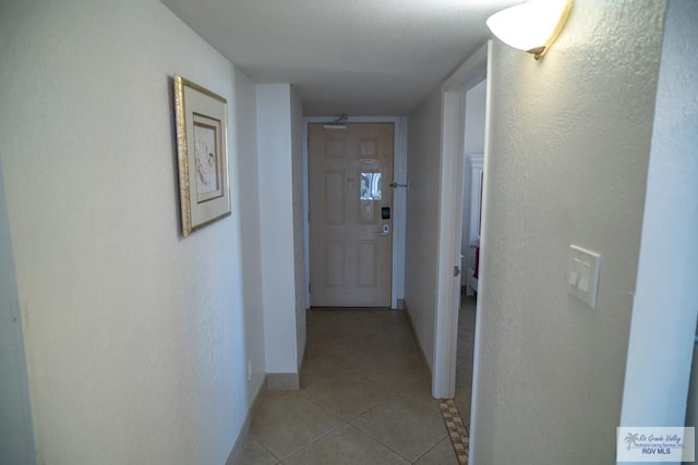 hallway with light tile patterned floors