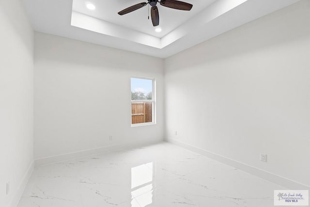 spare room with recessed lighting, marble finish floor, ceiling fan, and baseboards