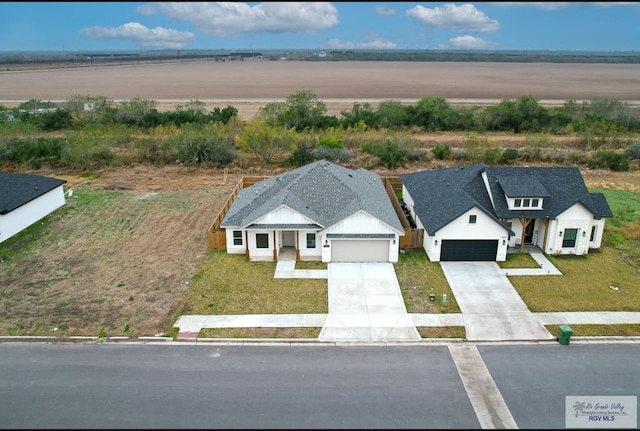 birds eye view of property with a rural view