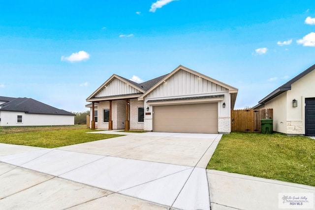 view of front of property featuring driveway, board and batten siding, brick siding, a front lawn, and a garage