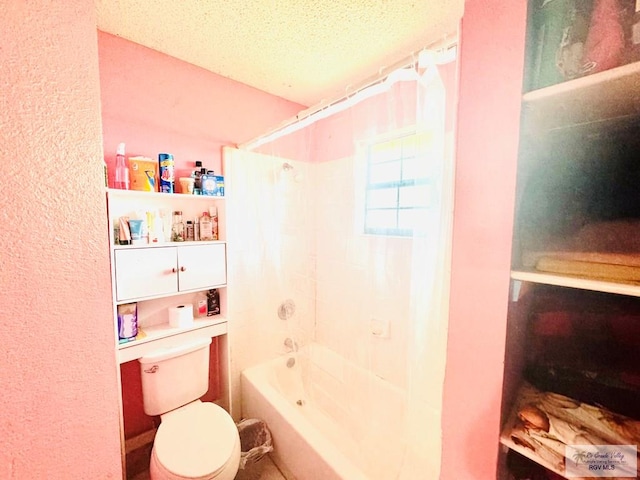 bathroom featuring shower / tub combination, a textured ceiling, and toilet