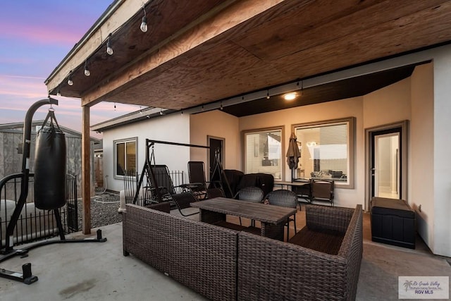 patio terrace at dusk with an outdoor hangout area