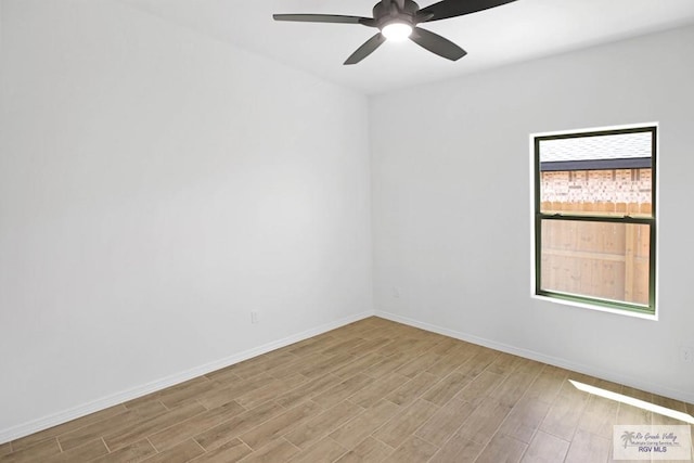 unfurnished room featuring light wood-type flooring and ceiling fan