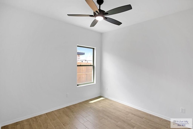 spare room featuring ceiling fan and light hardwood / wood-style flooring