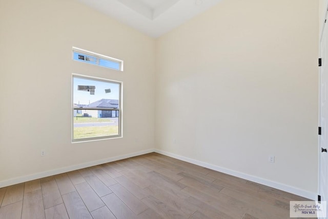 32773 Jorge St, Los Fresnos, TX 78566 - spare room featuring wood finished floors and baseboards