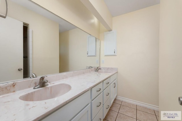 bathroom with tile patterned floors and vanity