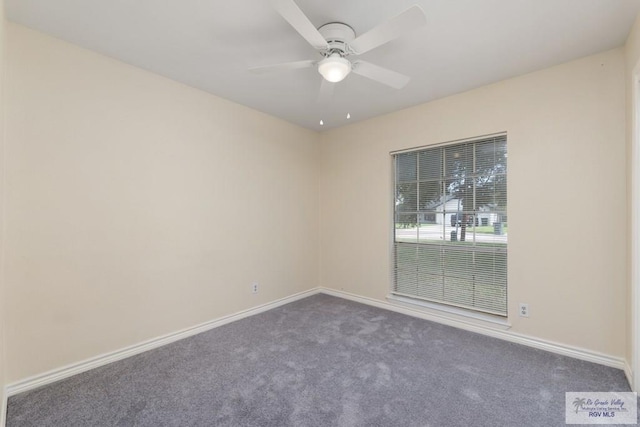 carpeted spare room featuring ceiling fan