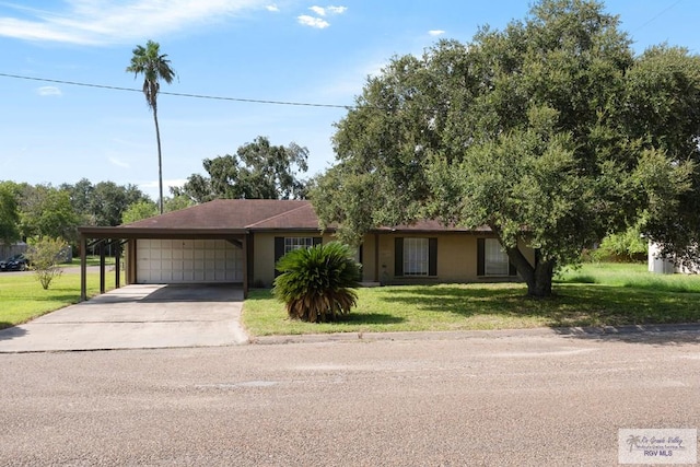 ranch-style house with a garage and a front lawn