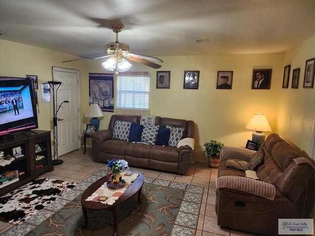 tiled living room featuring ceiling fan