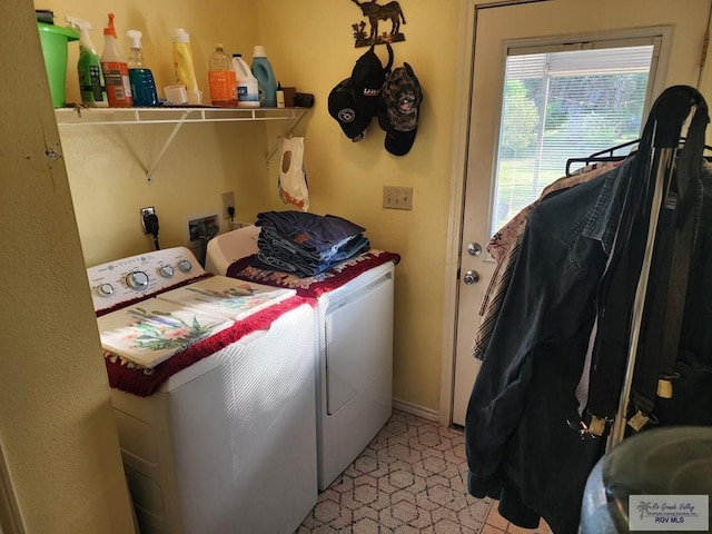 laundry area featuring independent washer and dryer and light tile patterned flooring