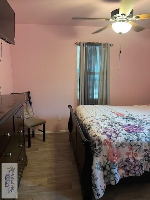 bedroom featuring ceiling fan and wood-type flooring