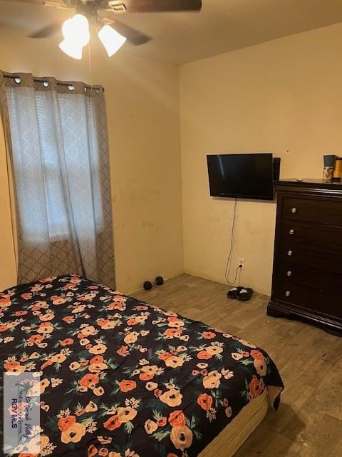 bedroom with light wood-type flooring and ceiling fan