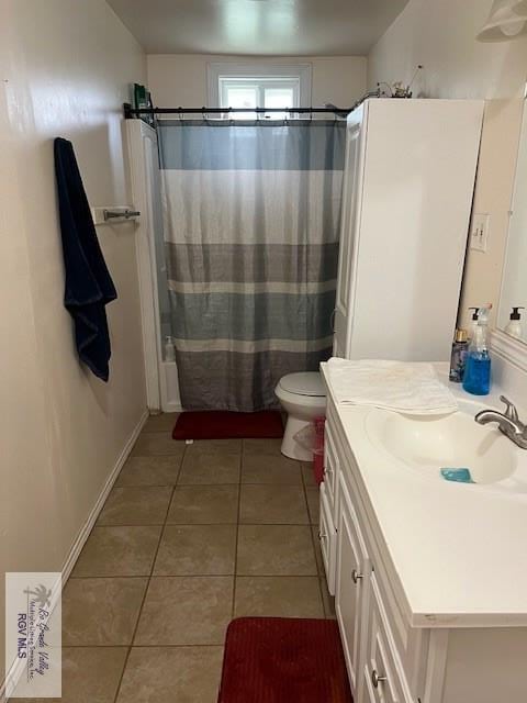 full bathroom featuring shower / bathtub combination with curtain, tile patterned flooring, vanity, and toilet