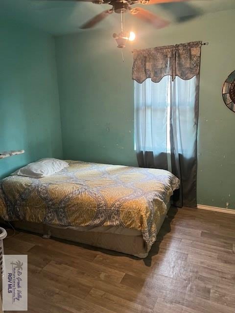 bedroom featuring ceiling fan and wood-type flooring