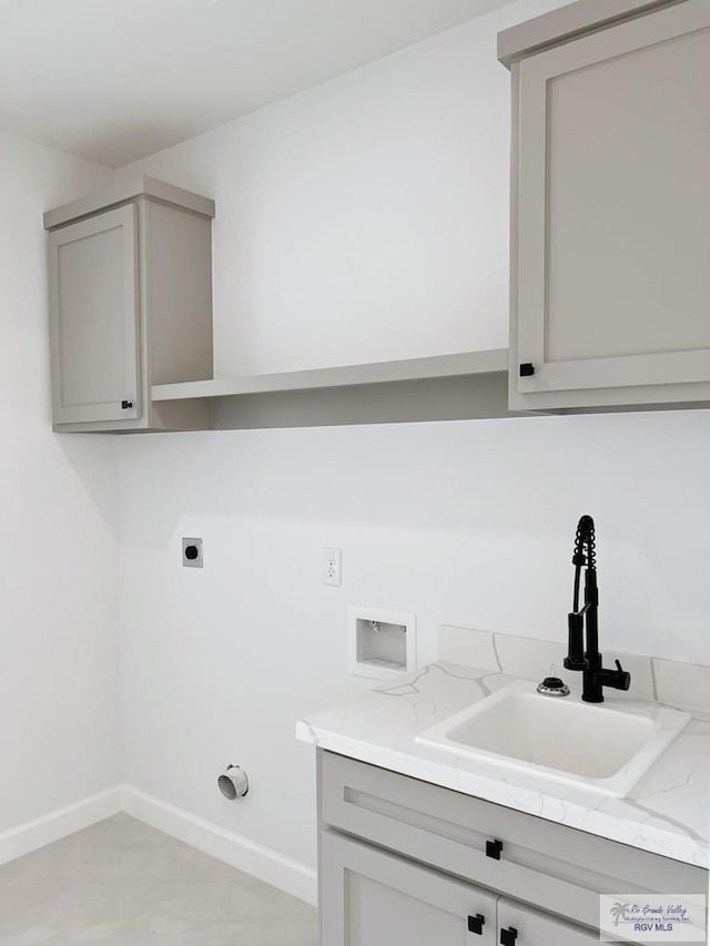 washroom featuring sink, cabinets, hookup for a washing machine, hookup for an electric dryer, and hookup for a gas dryer