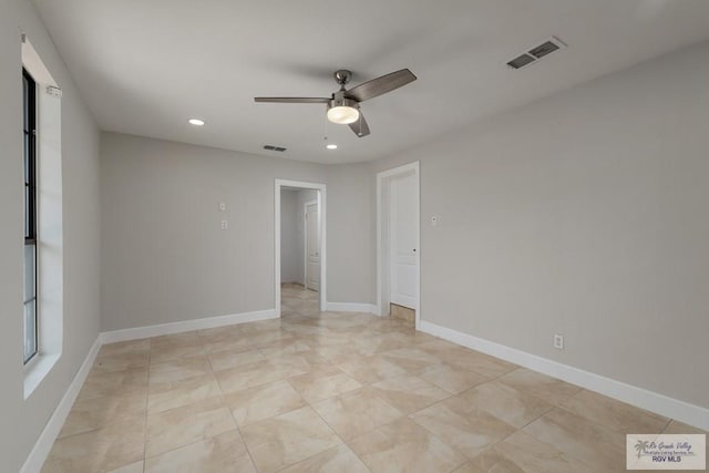 spare room featuring ceiling fan