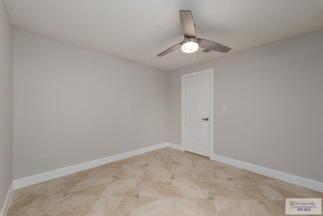 spare room with ceiling fan