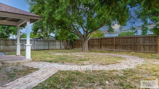 view of yard featuring ceiling fan