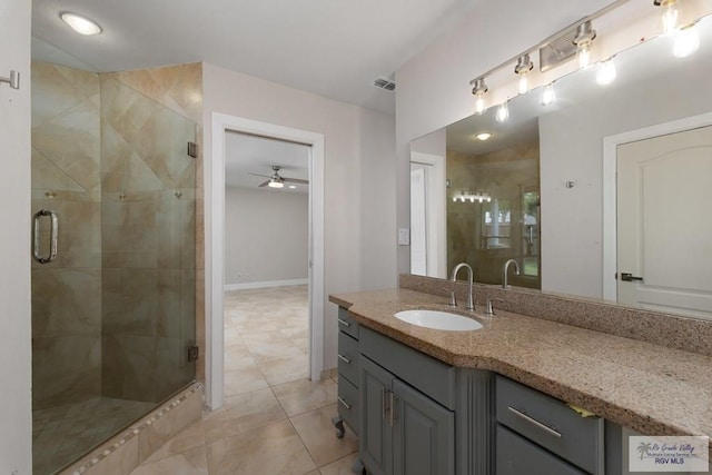 bathroom featuring vanity, tile patterned floors, ceiling fan, and a shower with shower door