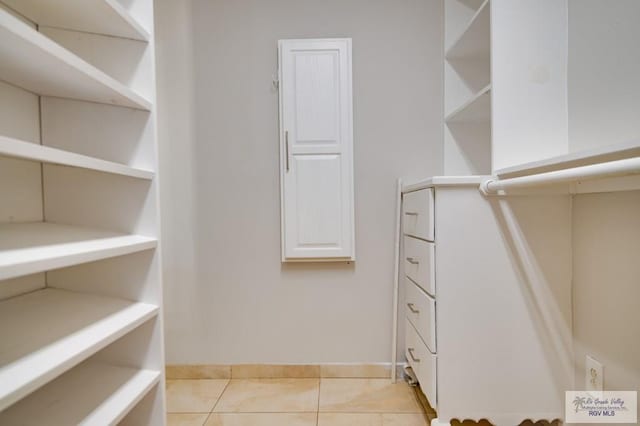 walk in closet featuring light tile patterned floors