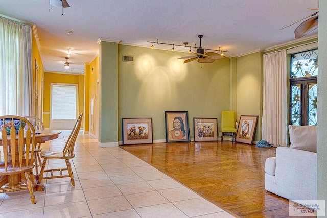 171 Line 17 Rd, San Benito, TX 78586 - tiled dining room with ceiling fan, ornamental molding, and track lighting