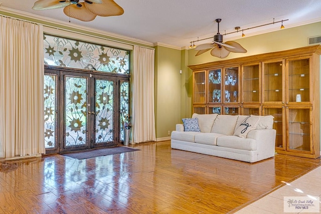 171 Line 17 Rd, San Benito, TX 78586 - living area with ceiling fan, ornamental molding, wood finished floors, and french doors