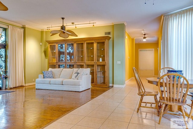 171 Line 17 Rd, San Benito, TX 78586 - living room featuring a ceiling fan, ornamental molding, and light tile patterned floors
