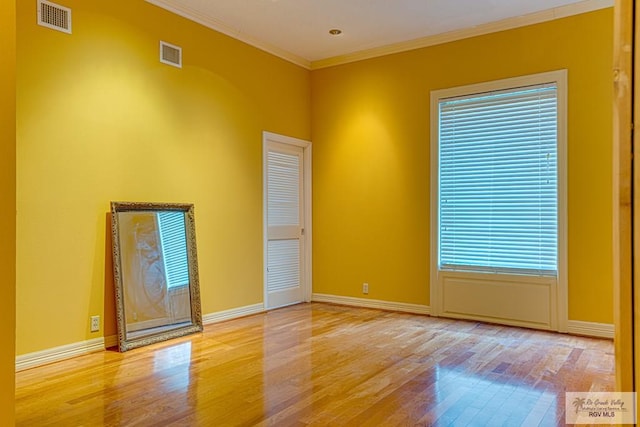 171 Line 17 Rd, San Benito, TX 78586 - spare room featuring wood finished floors and ornamental molding