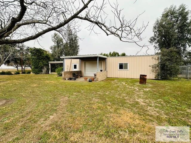 back of house with a yard