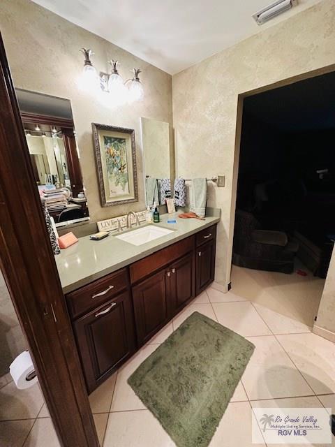 bathroom with vanity and tile patterned floors