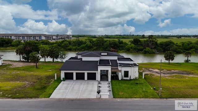 drone / aerial view with a water view