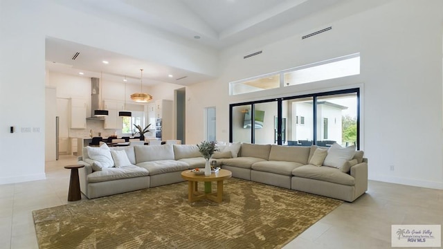 60 Jacklyn St, Rancho Viejo, TX 78575 - living room with high vaulted ceiling and light tile patterned floors