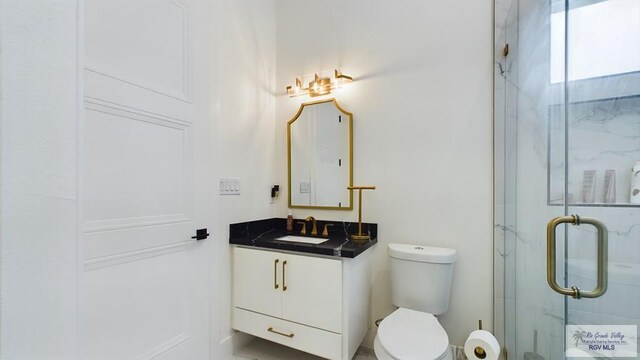 60 Jacklyn St, Rancho Viejo, TX 78575 - bathroom featuring walk in shower, vanity, and toilet