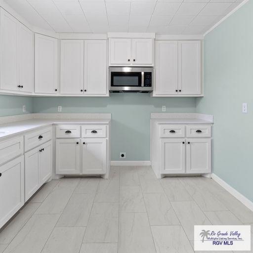 kitchen featuring white cabinets