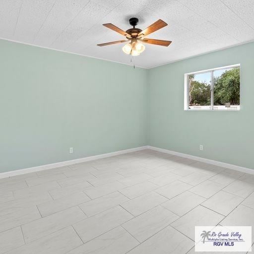 1802 High St, Harlingen, TX 78550 - tiled spare room featuring ceiling fan