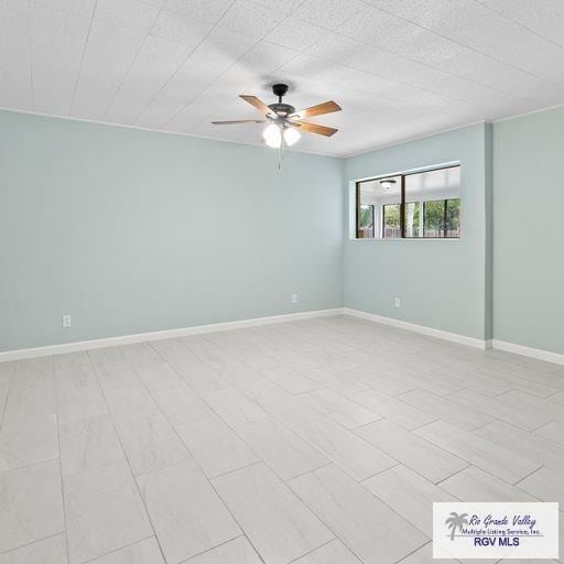 unfurnished room featuring ceiling fan