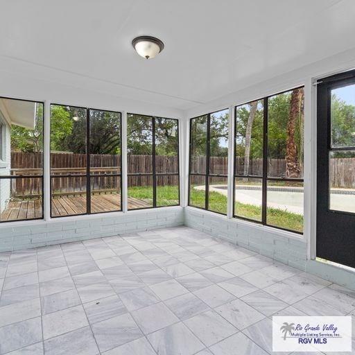 view of unfurnished sunroom