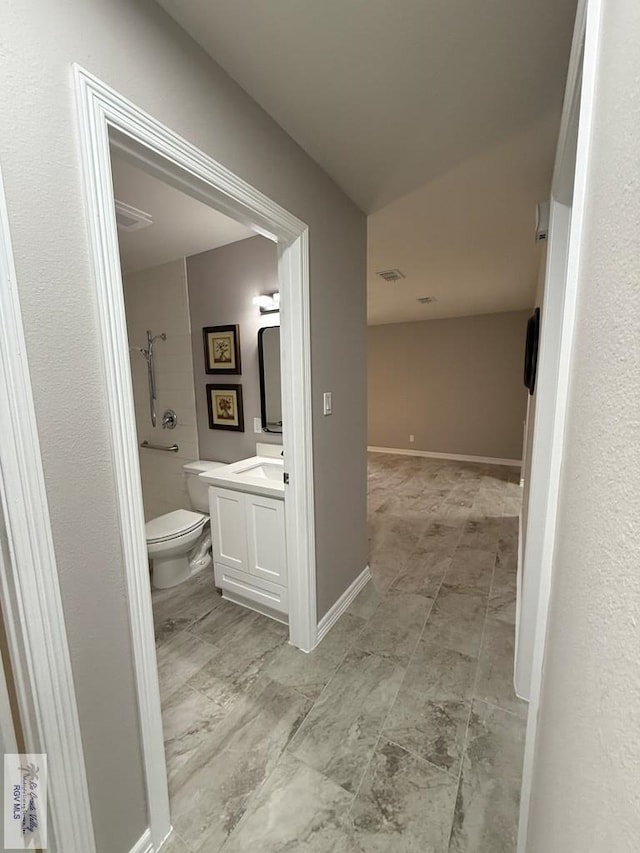 902 Rio Hondo Rd, Harlingen, TX 78550 - full bathroom featuring toilet, vanity, and a shower