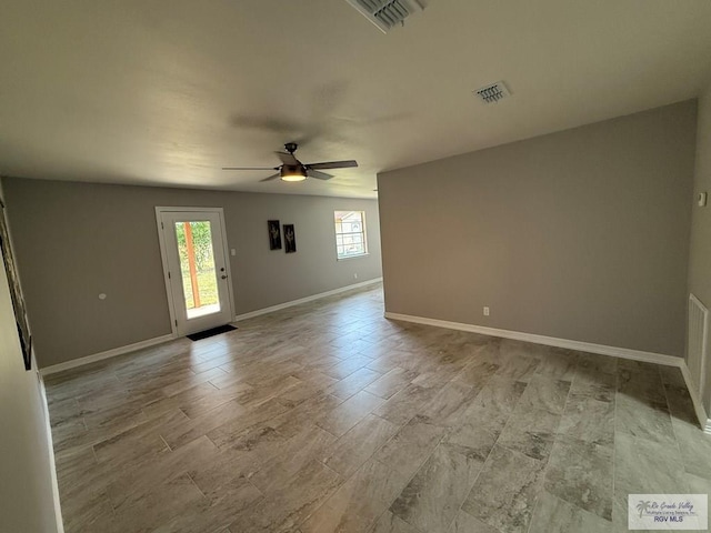 902 Rio Hondo Rd, Harlingen, TX 78550 - spare room with a ceiling fan and baseboards