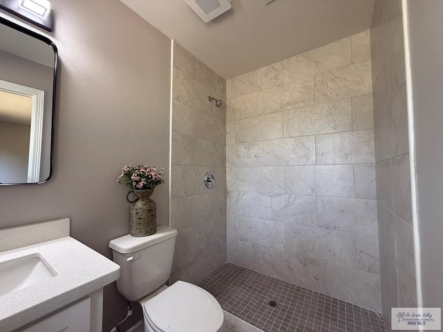 902 Rio Hondo Rd, Harlingen, TX 78550 - bathroom with vanity, a tile shower, and toilet