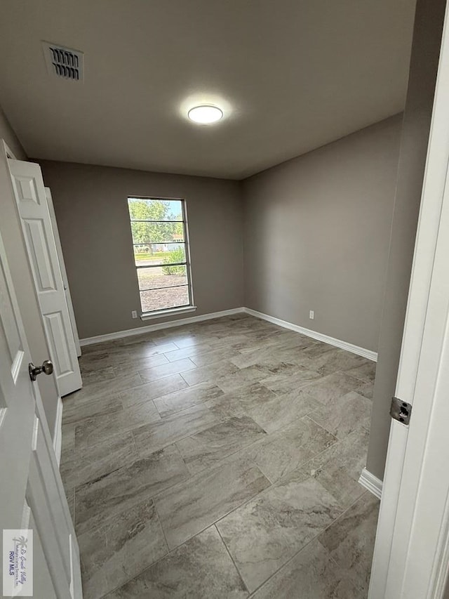 902 Rio Hondo Rd, Harlingen, TX 78550 - empty room featuring baseboards