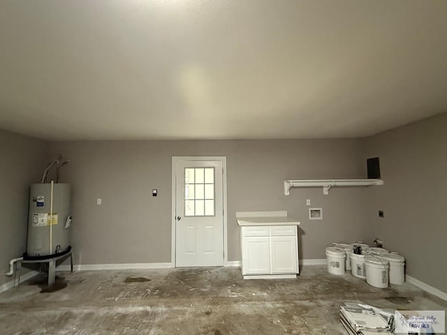 902 Rio Hondo Rd, Harlingen, TX 78550 - garage featuring water heater and baseboards