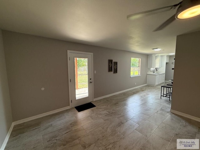 902 Rio Hondo Rd, Harlingen, TX 78550 - foyer entrance featuring baseboards and a ceiling fan