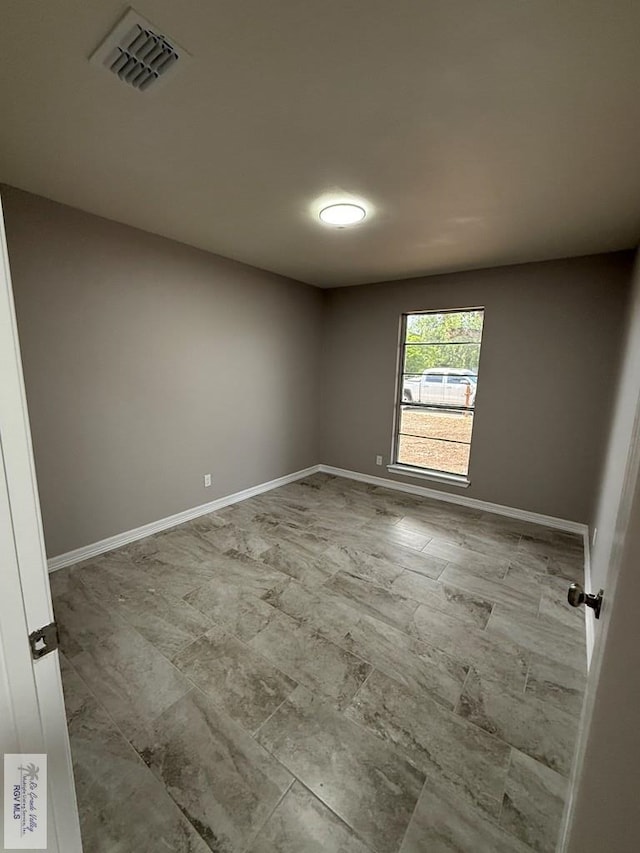 902 Rio Hondo Rd, Harlingen, TX 78550 - spare room featuring baseboards
