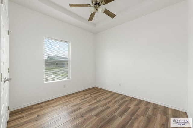 empty room featuring ceiling fan and wood-type flooring