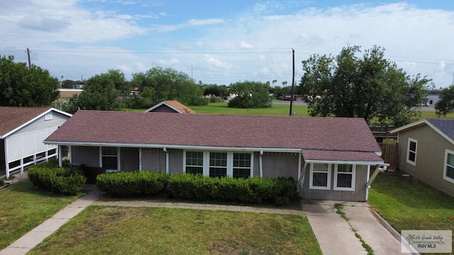 205 W Beck Ave, Harlingen, TX 78550 - view of front facade featuring a front lawn and concrete driveway