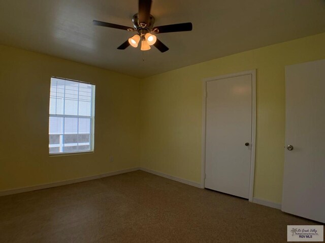 205 W Beck Ave, Harlingen, TX 78550 - unfurnished bedroom with carpet and a ceiling fan