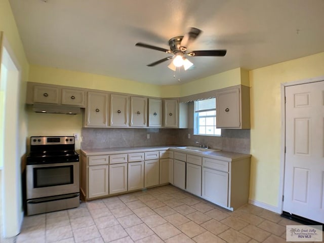205 W Beck Ave, Harlingen, TX 78550 - kitchen featuring stainless steel range with electric stovetop, light countertops, a ceiling fan, and under cabinet range hood