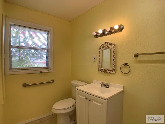 205 W Beck Ave, Harlingen, TX 78550 - half bathroom with vanity and tile patterned flooring
